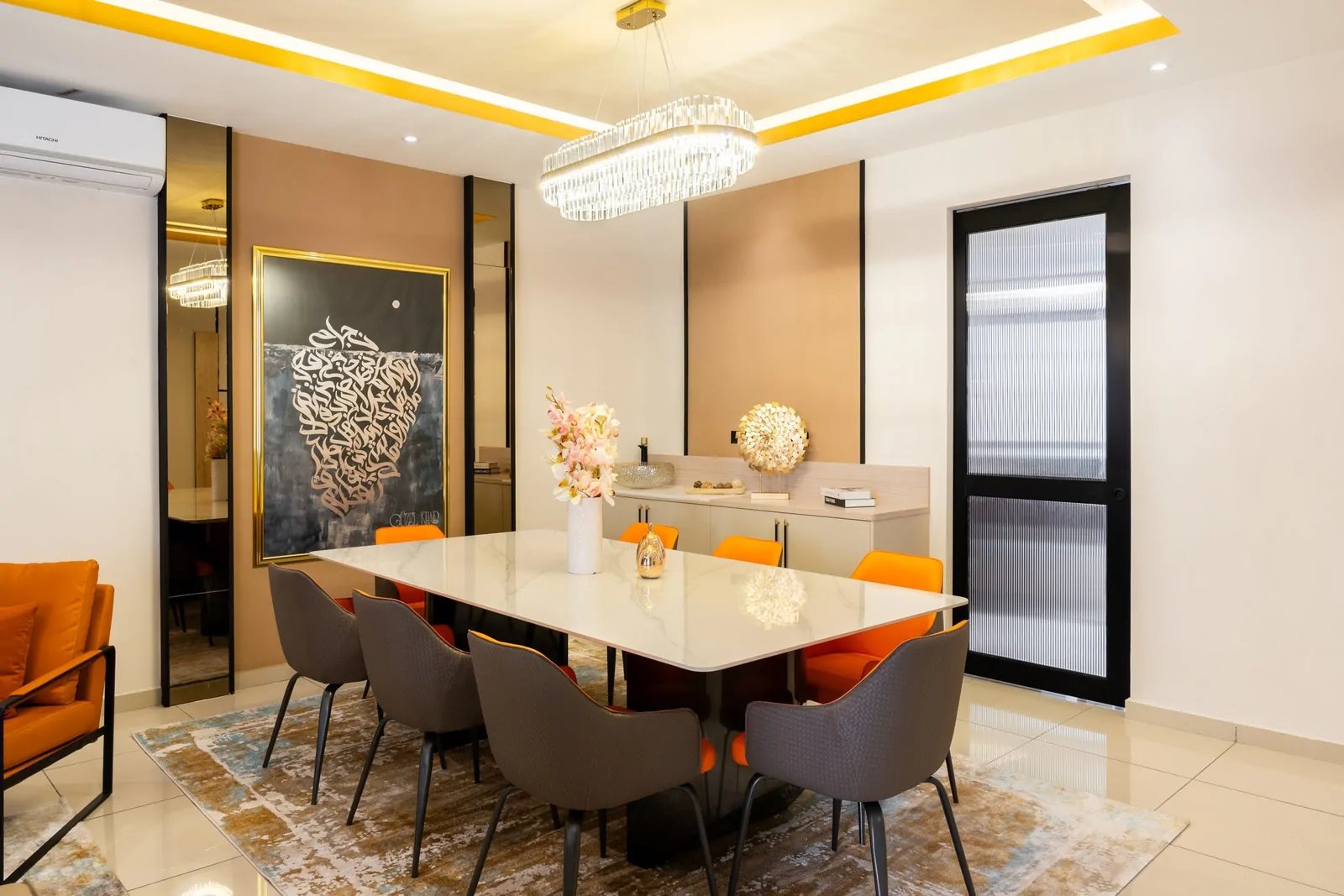 Dining area with a coffered ceiling, concealed lighting, a crystal chandelier, a mirrored panel and a sideboard, Serimba Residence, Kajang, Malaysia, by Blaine Robert Design
