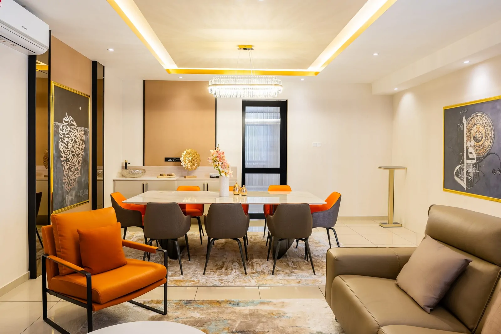 Dining room with framed calligraphy artwork, a sideboard and a crystal chandelier, Serimba Residence, Kajang, Malaysia, by Blaine Robert Design