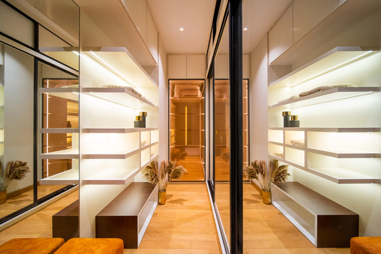 Wardrobe walk-through with sliding glass doors and lit open shelves between bedroom and bathroom, a bungalow in Bangsar, Kuala Lumpur, Malaysia, by Blaine Robert Design