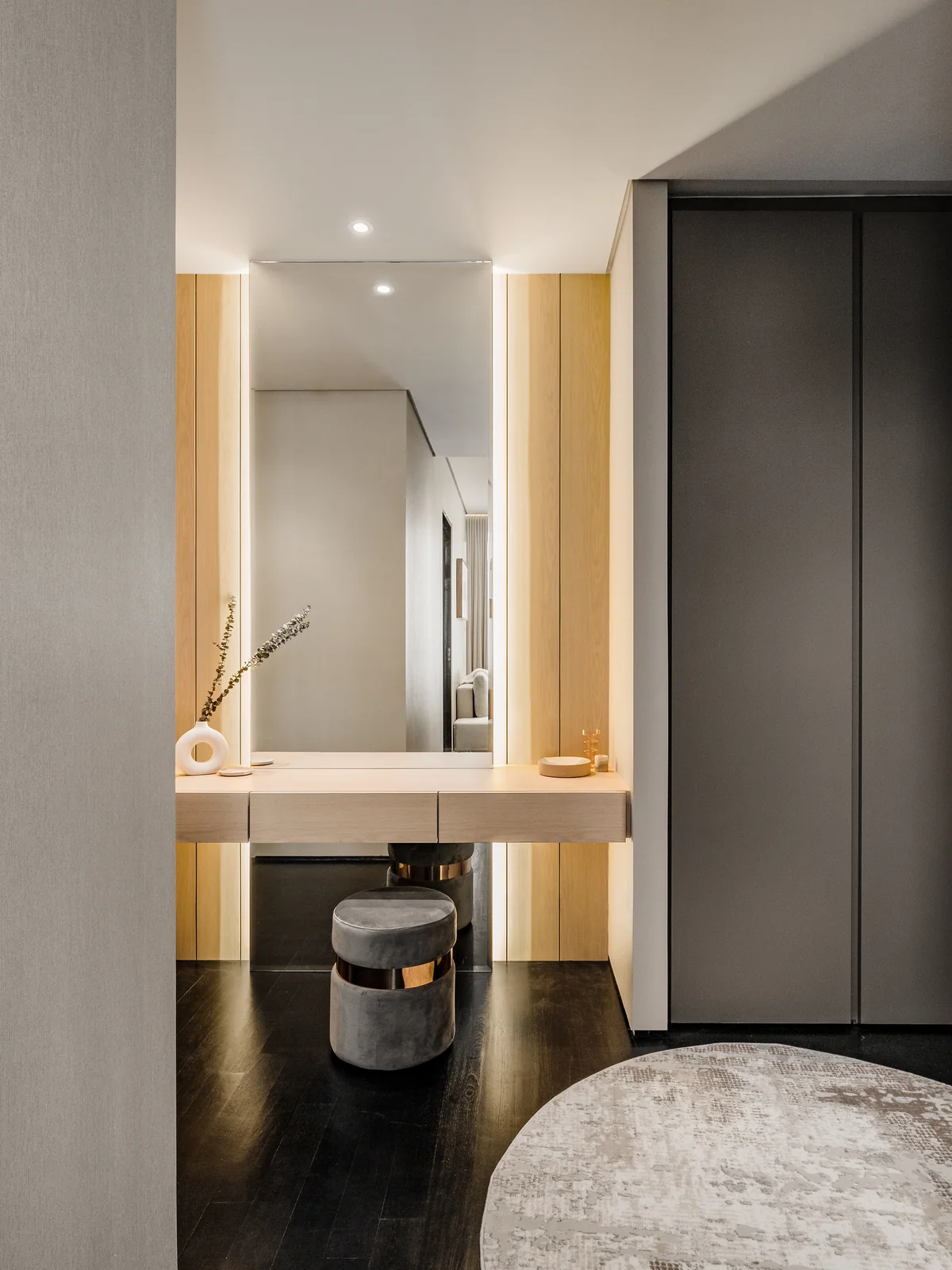 Dressing vanity alcove with a lit mirror and a stool, Four Seasons Residences, Kuala Lumpur, Malaysia, by Blaine Robert Design